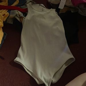 Cream colored bodysuit. Barley worn.